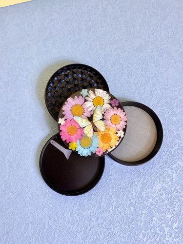 flower grinder with real flowers and butterfly
