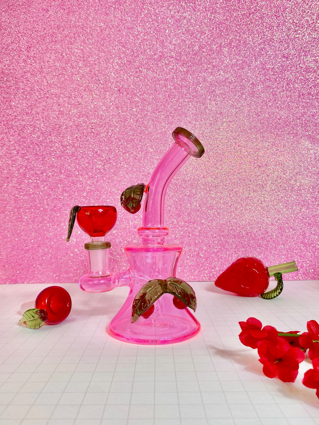 neon pink bong with cherries and cherry bowl