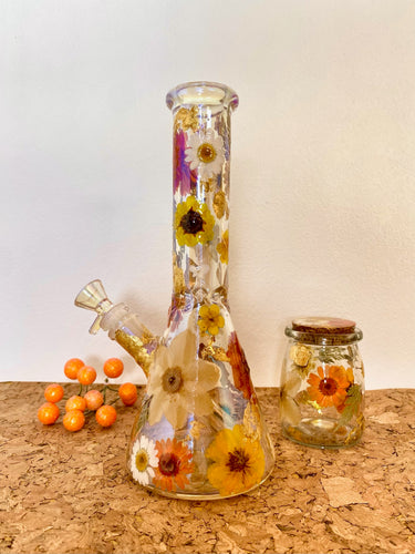 iridescent bong with orange flowers and gold flecks