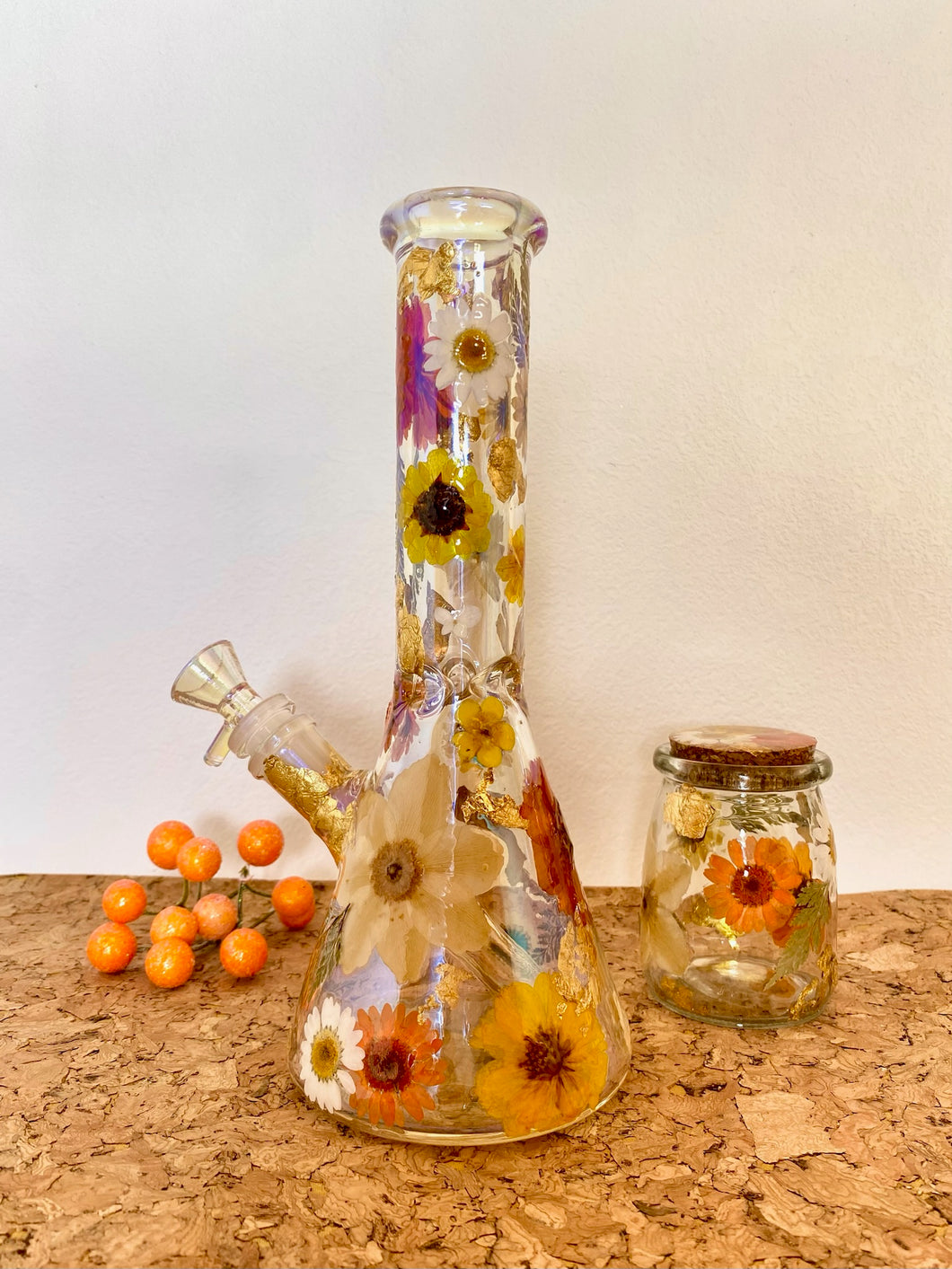 iridescent bong with orange flowers and gold flecks