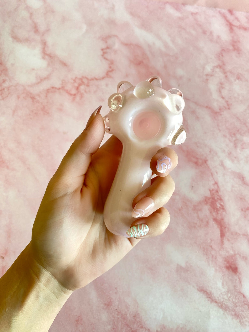 light pink hand pipe with glass bubbles